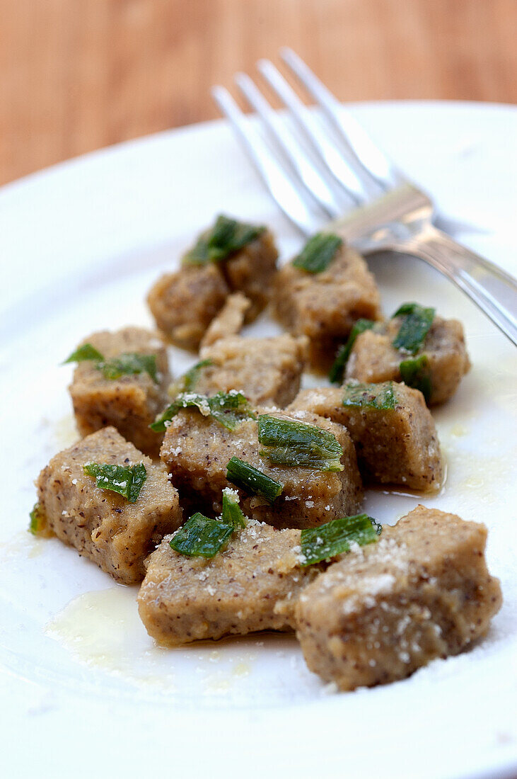 Polenta di Roveja (polenta with wild pea flour) served with sage butter