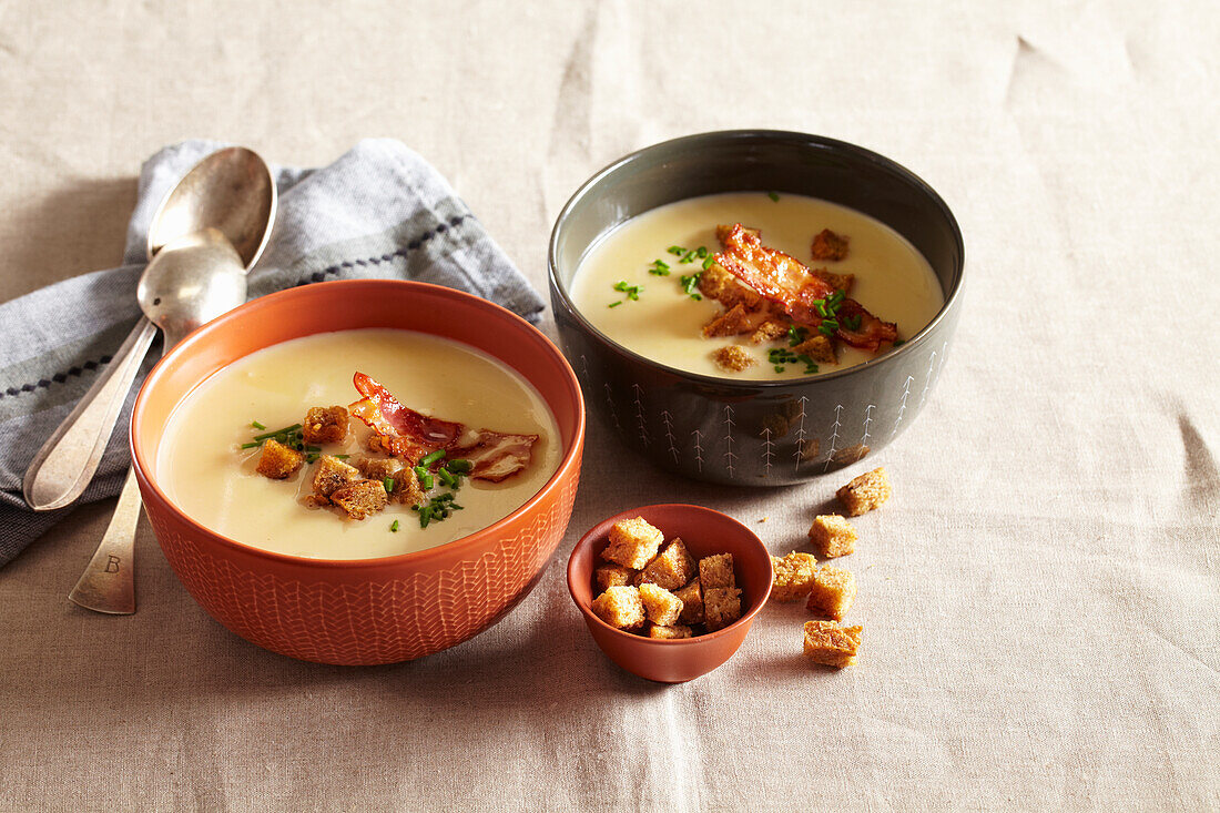 Creamy garlic soup with croutons and bacon