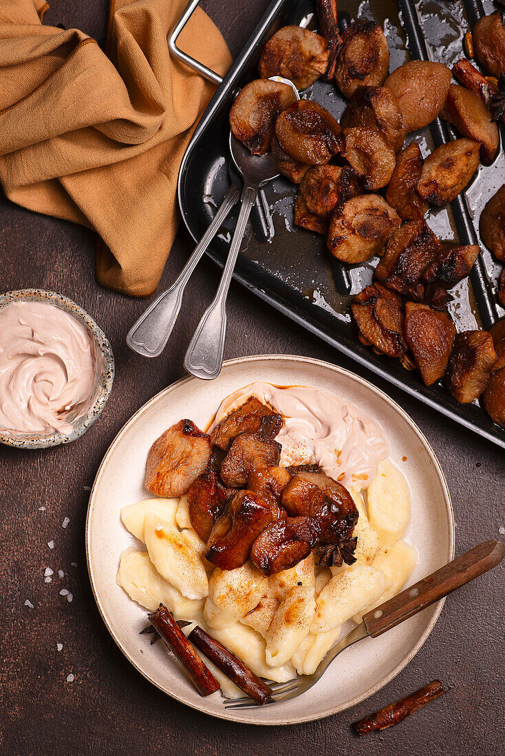 Ricotta dumplings with chocolate skyr and baked plums