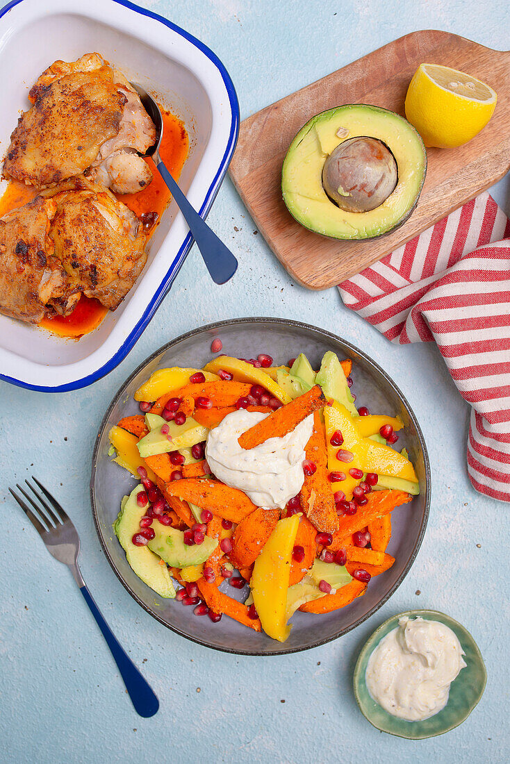 Chicken breast and sweet potato salad with avocado and mango