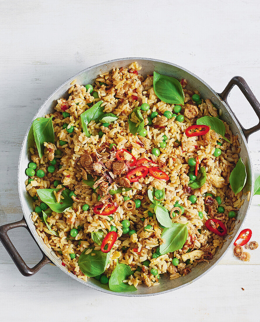 Fried rice with peas, chilli peppers and Thai basil