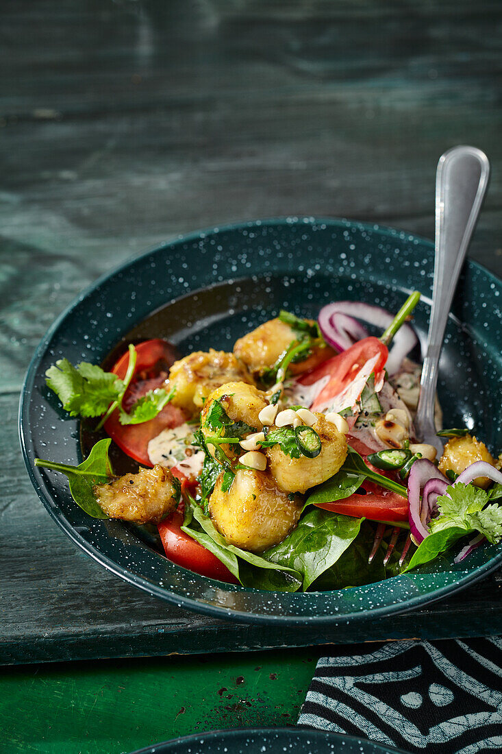 South African curry banana salad with red onions and tomatoes