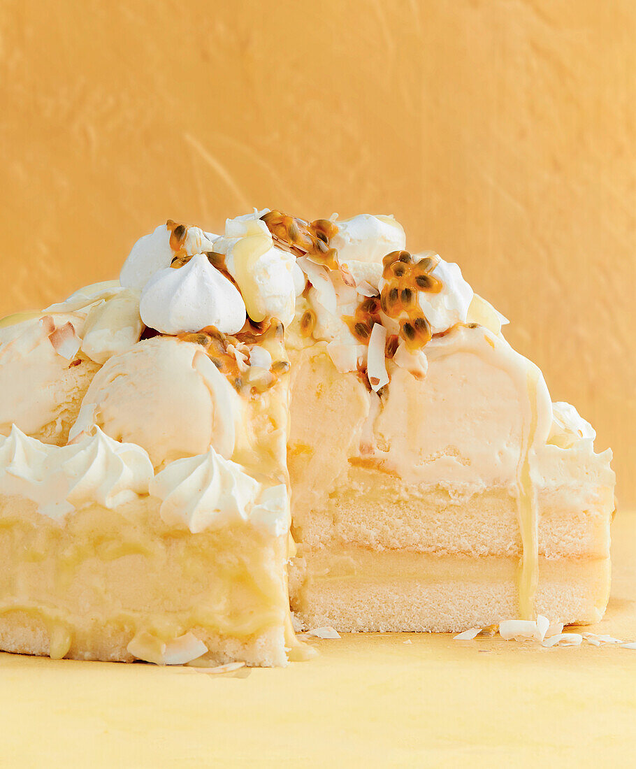 Passion fruit ice cream cake with cream and meringue