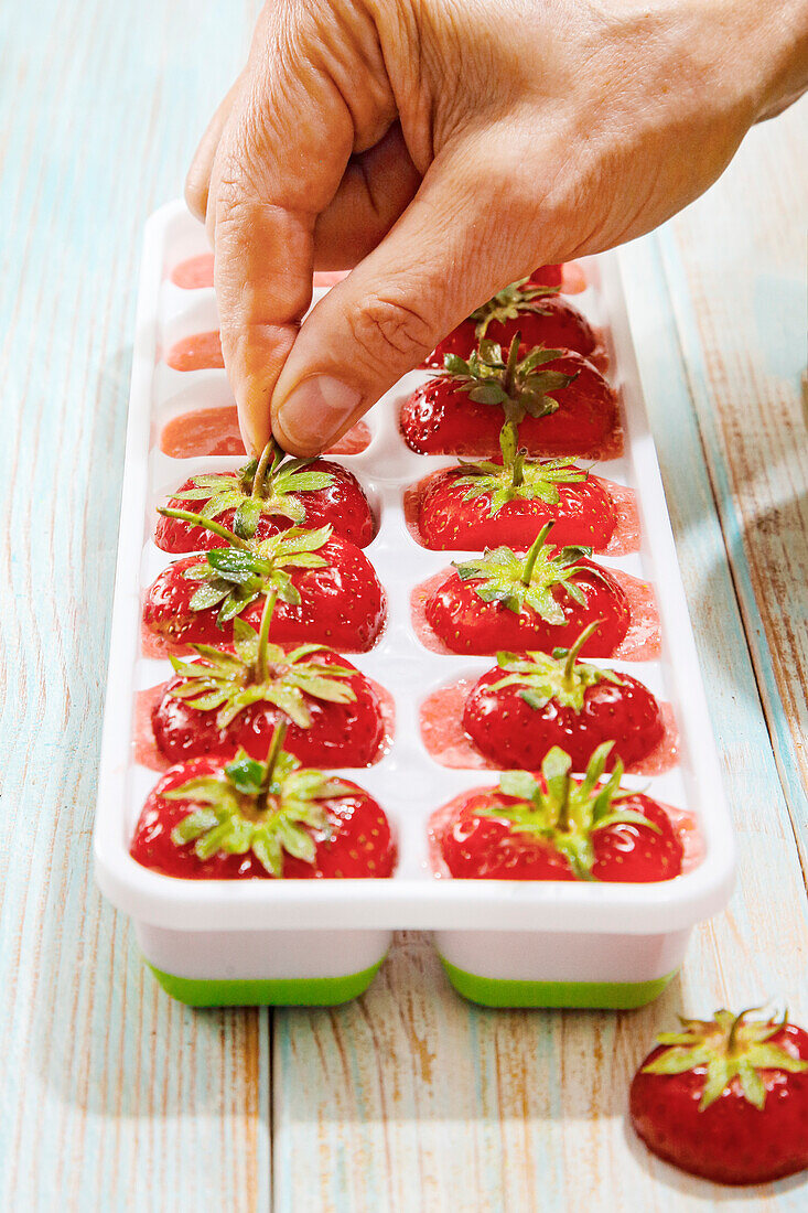 Making strawberry ice cubes