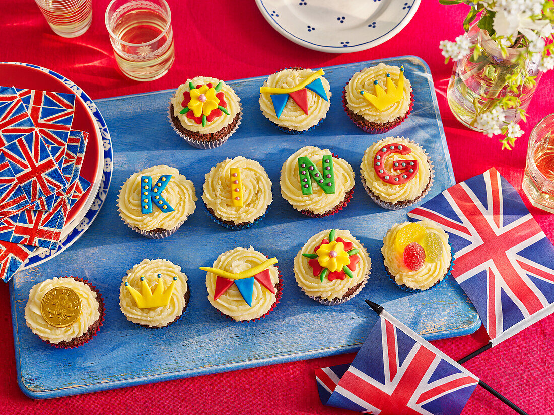 Cupcakes with royal and letter decorations