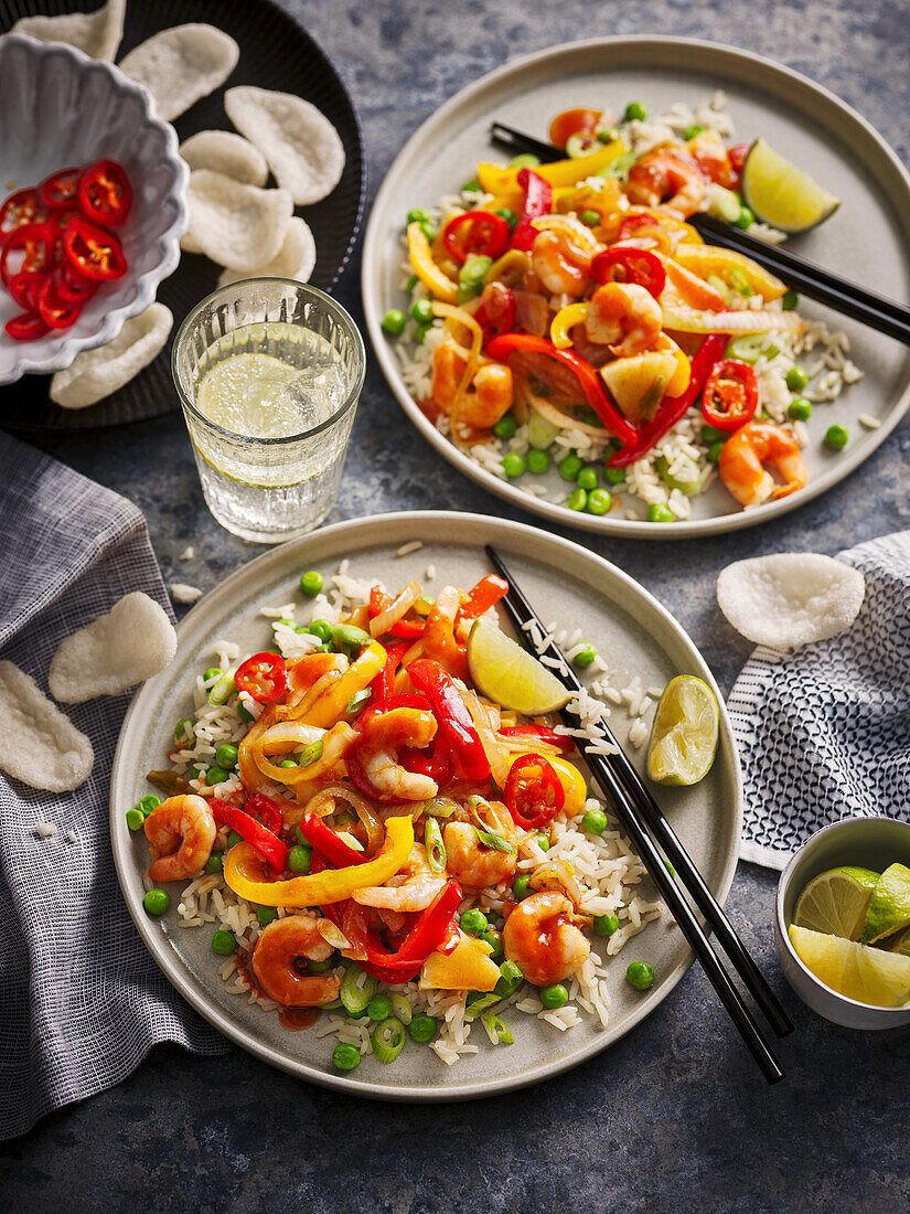 Prawn and vegetable pan with peppers and lime on rice