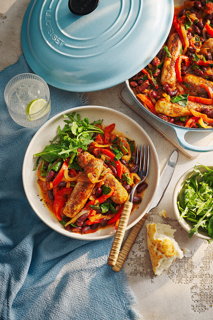 Sausage and bean stew with peppers and rocket