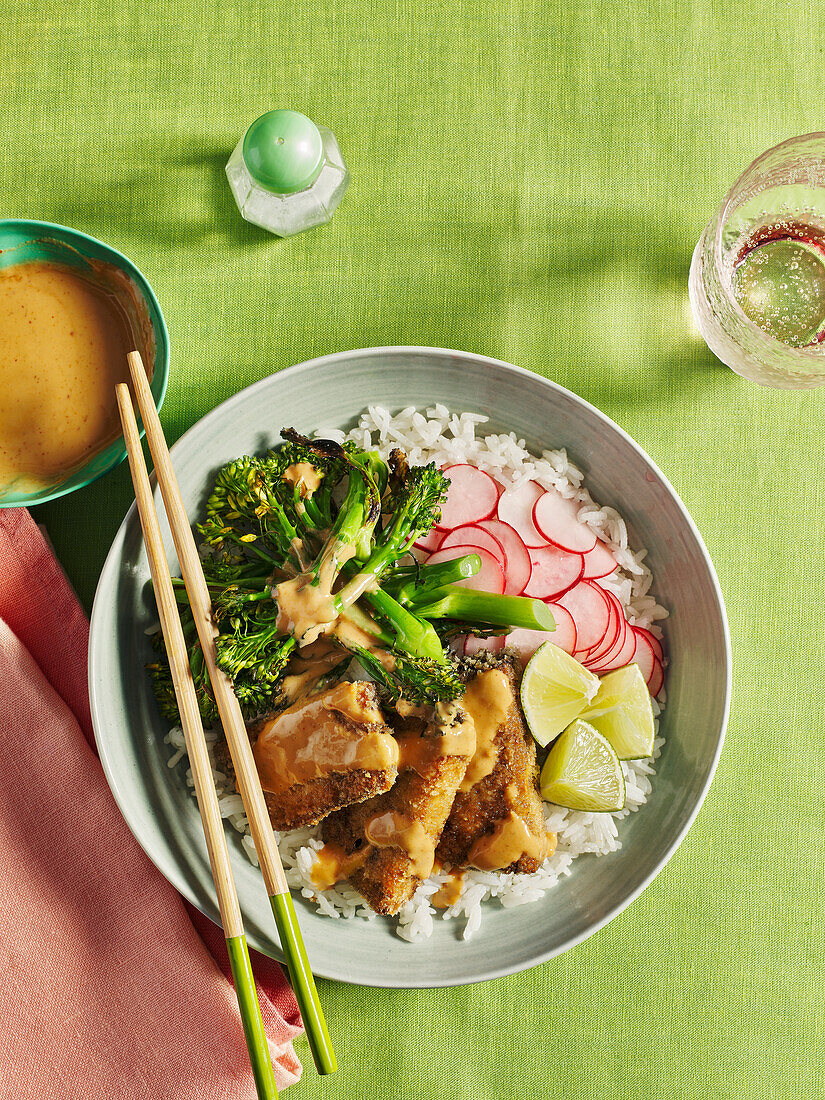 Rice bowl with crispy tofu satay and vegetables