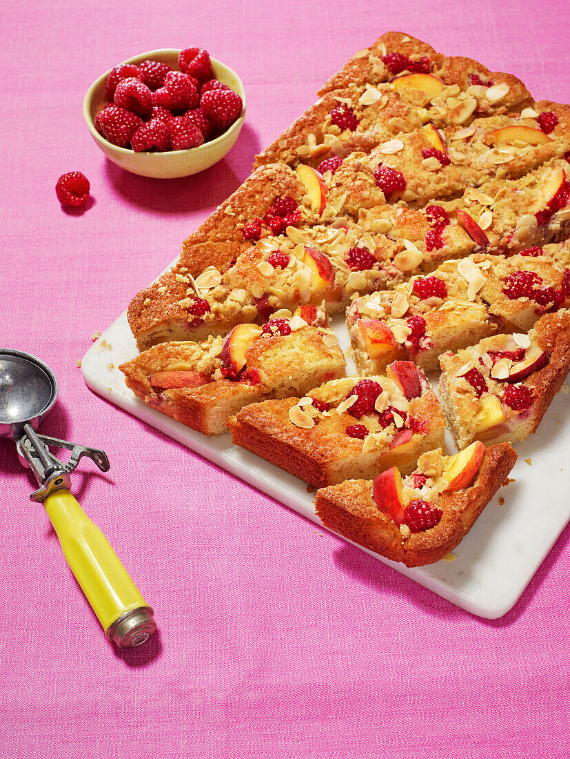 Peach and raspberry crumble cake with almonds