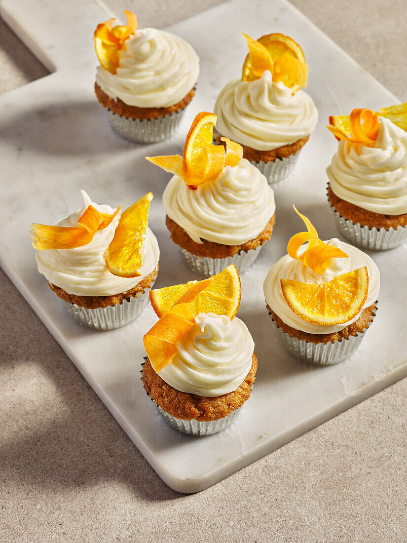 Carrot and orange cupcakes with cream cheese topping