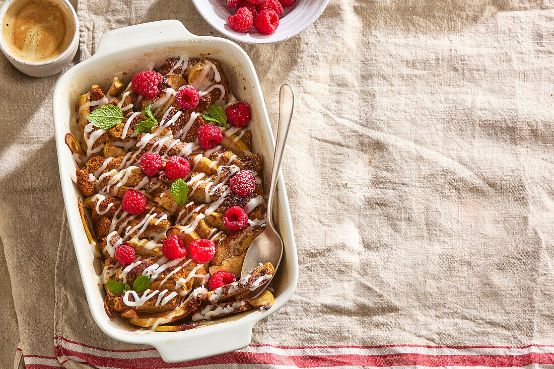 Baked French toast with apple, raspberries and cinnamon from the oven