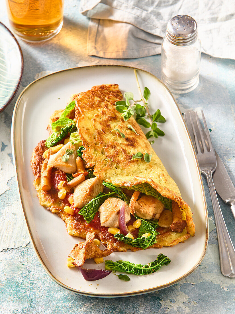 Stuffed potato omelette with chicken and vegetables