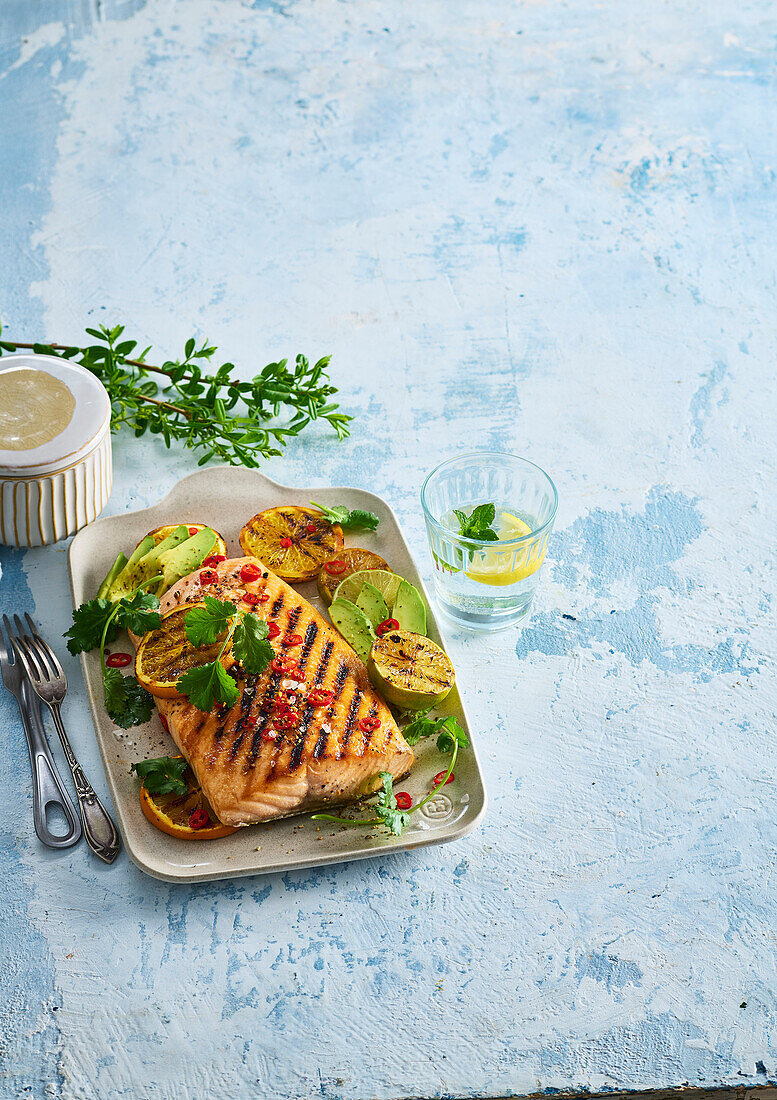 Grilled orange salmon with avocado and chilli