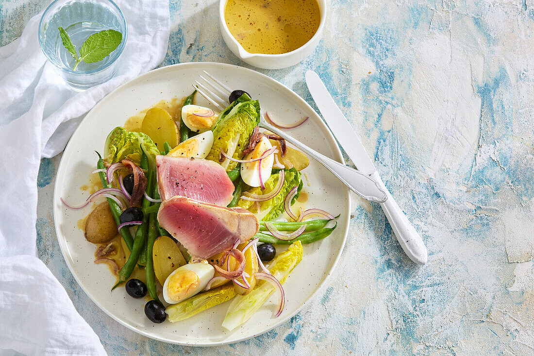 Nicoise salad with tuna, eggs, beans and olives