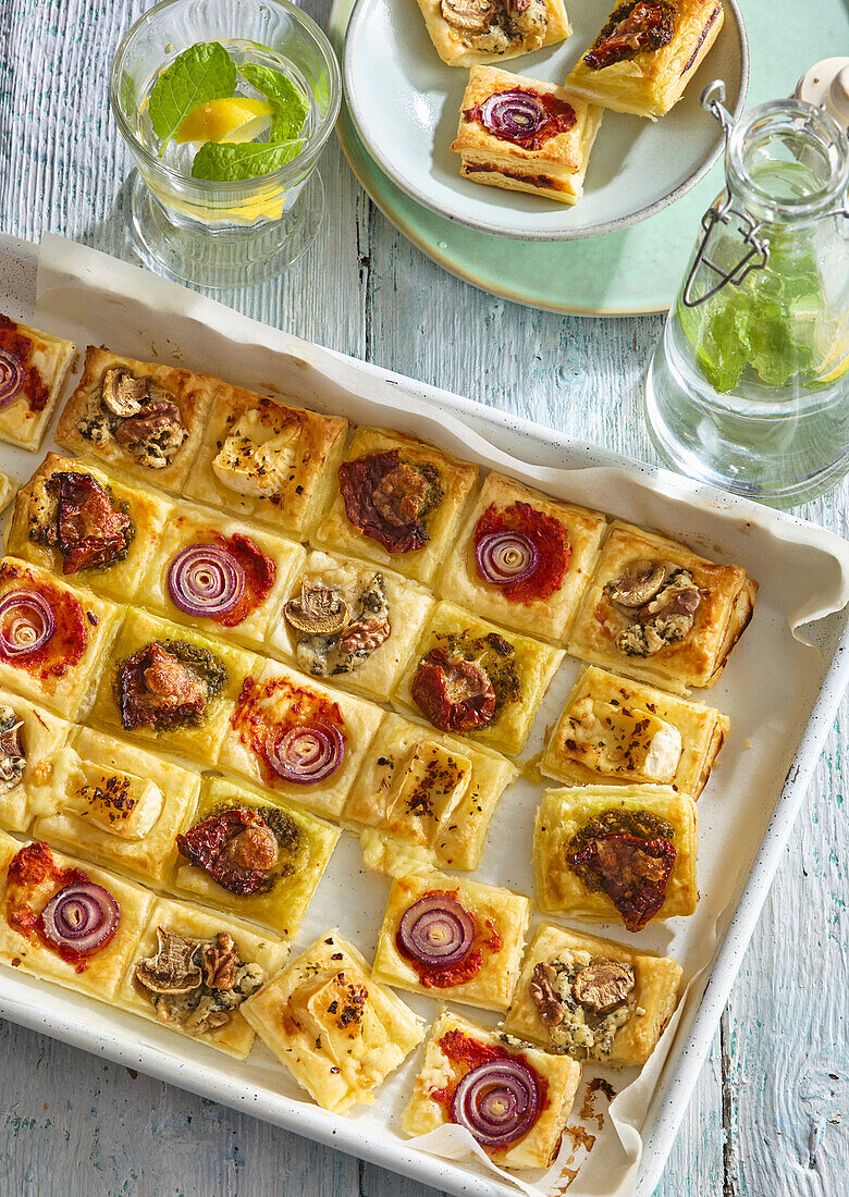 Piquant puff pastry canapés with various toppings