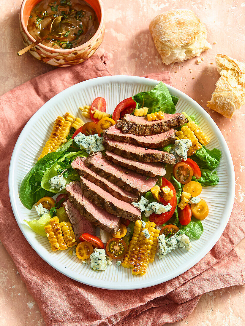 Salad with grilled beef steak, blue cheese and sweetcorn