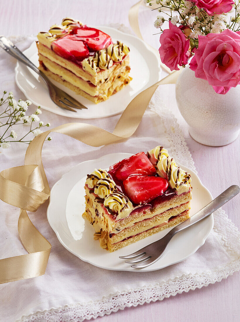 Strawberry tartlets with custard and chocolate icing