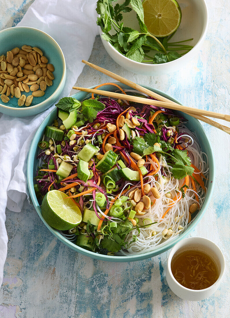 Thai noodle salad with vegetables, peanuts and lime