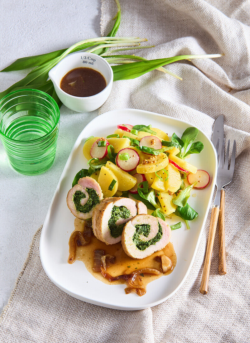 Pork roulade with spinach filling and potato salad