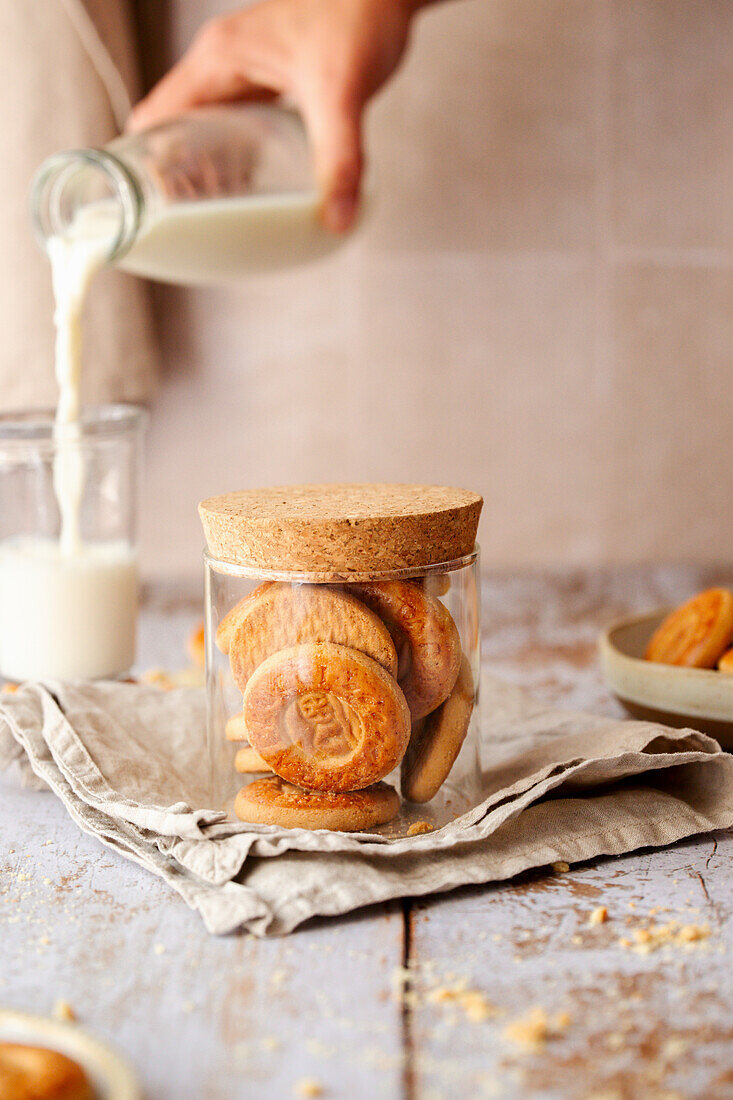 Butter cookies in a glass, milk is poured in