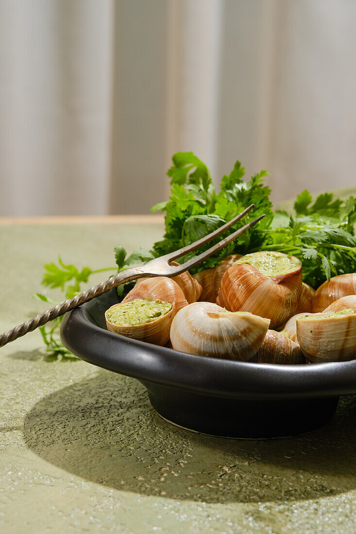 Escargots in herb butter with parsley