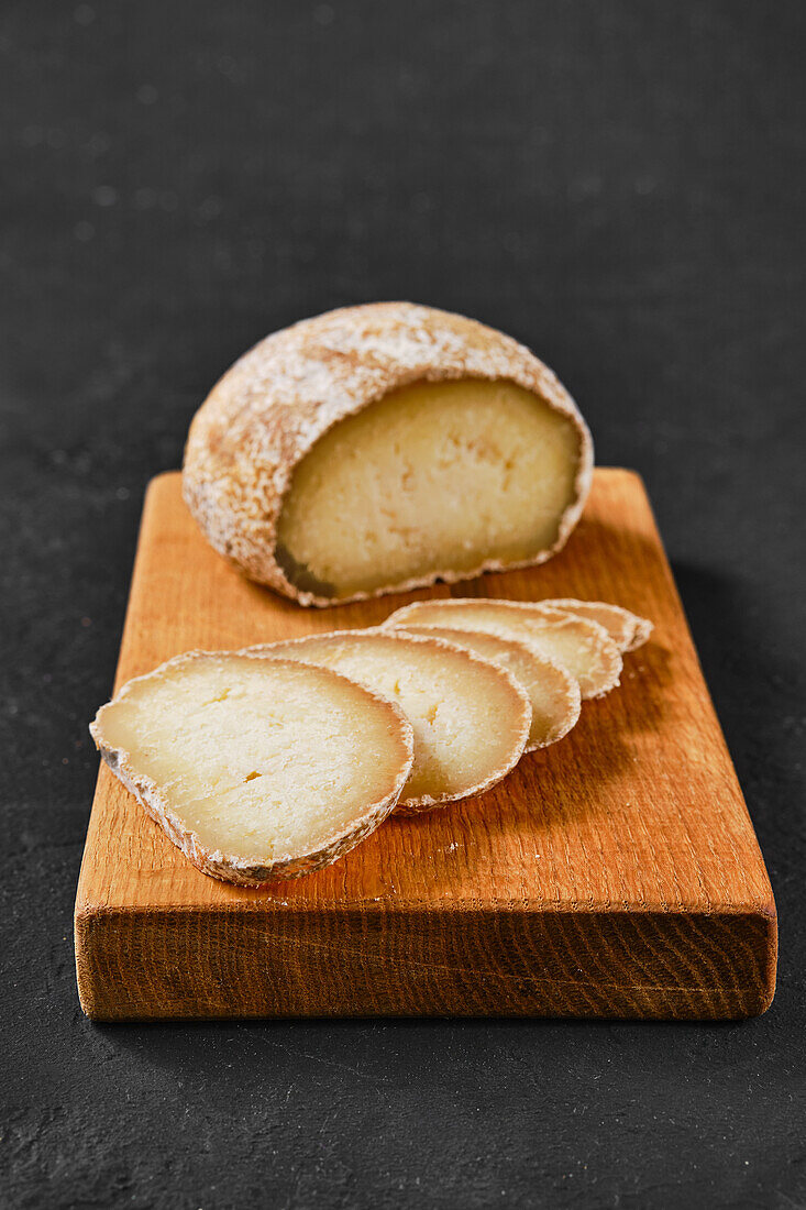 Sliced Georgian dambalkhacho on a wooden board