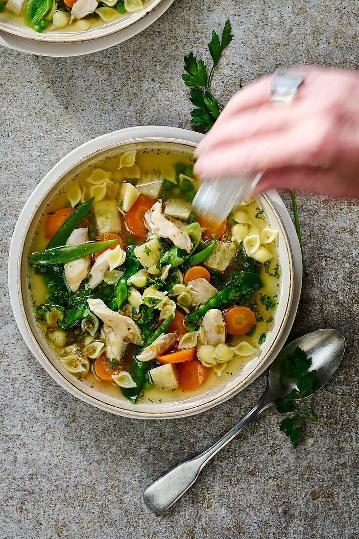 Chicken soup with soup noodles and vegetables