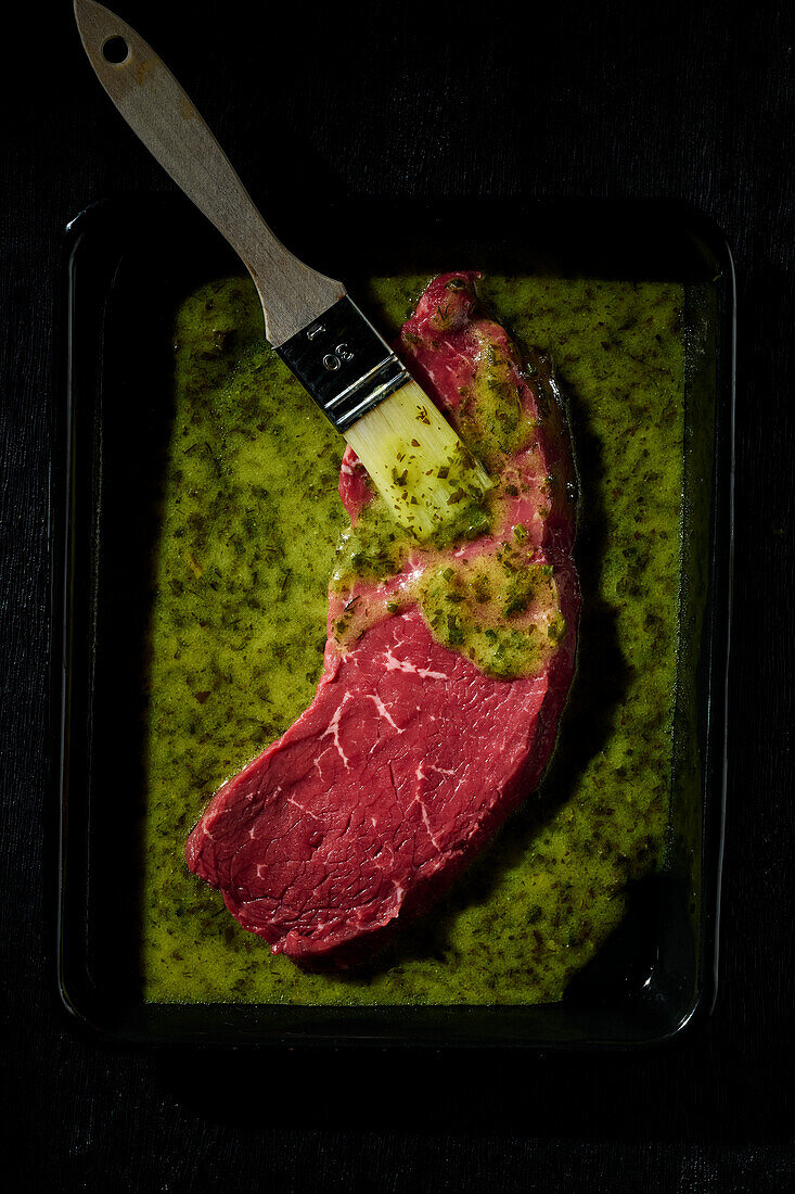 Marinate rump steak with herb marinade