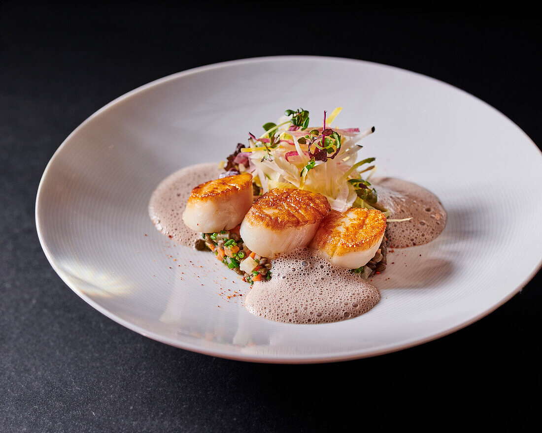 Scallops with truffle emulsion and lentils