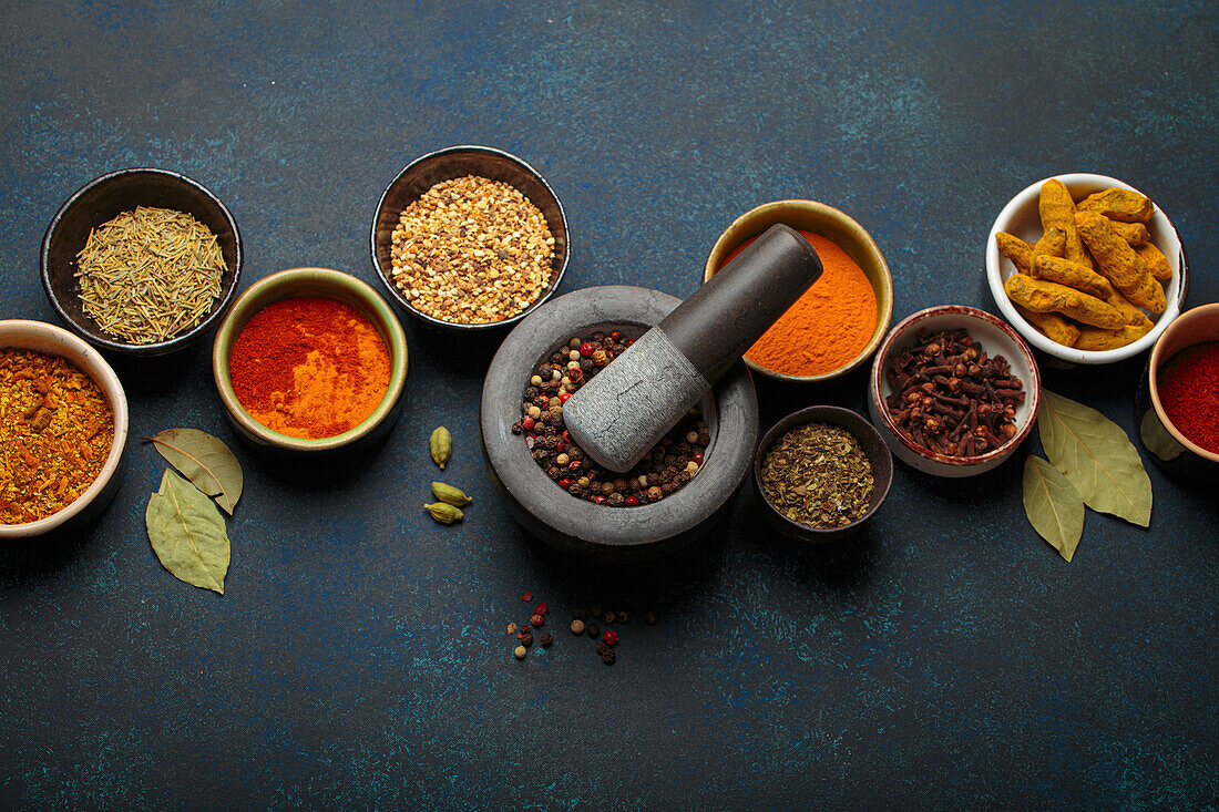 Various spices and herbs in bowls