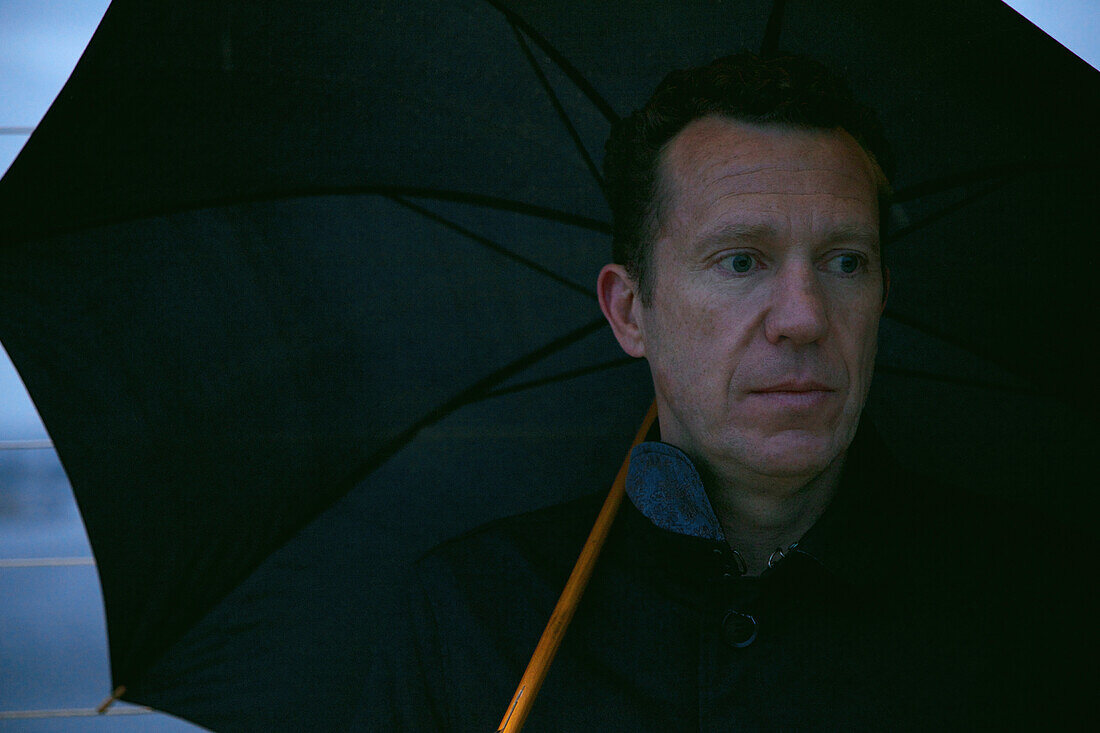 Portrait of Man under Umbrella