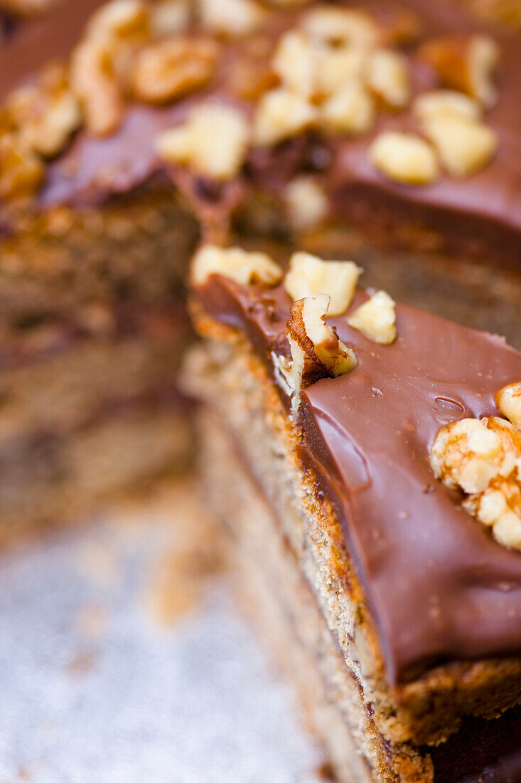 Extreme close up of a slice of walnut and chocolate gateau