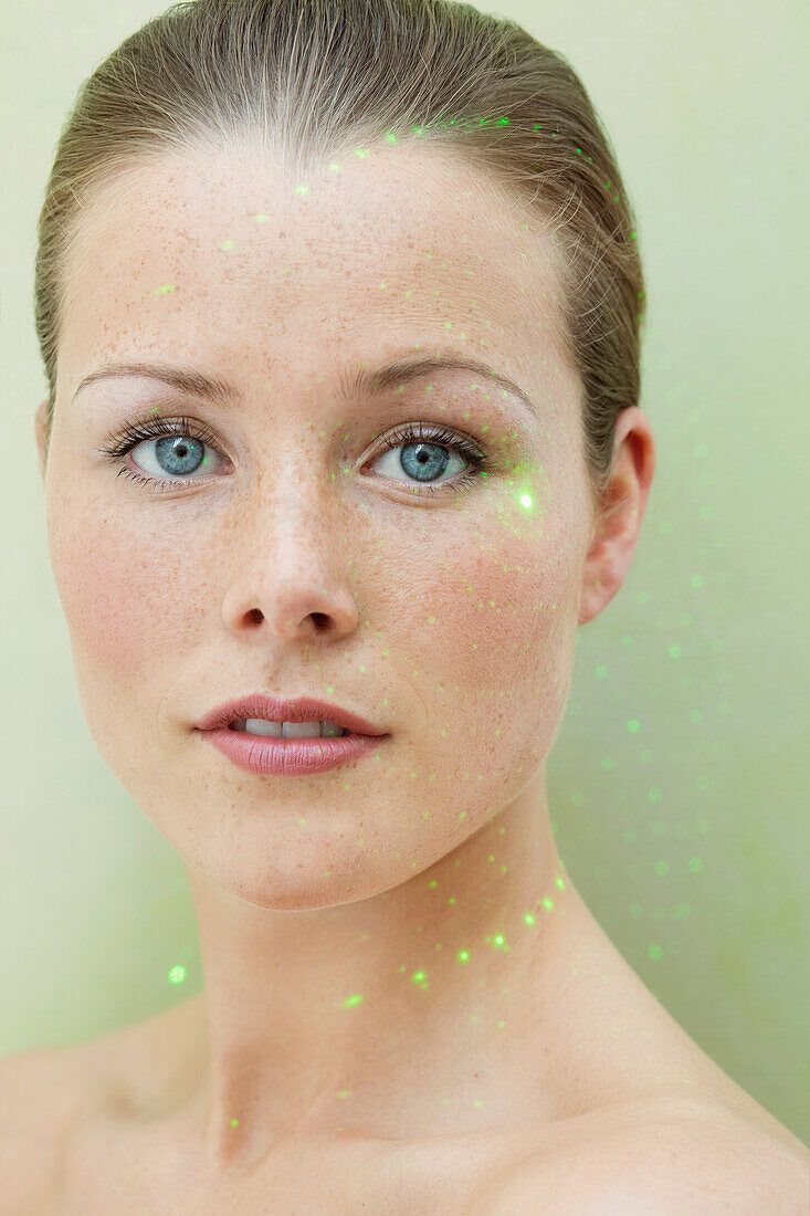 Beauty Portrait of Woman with Laser beam on Face