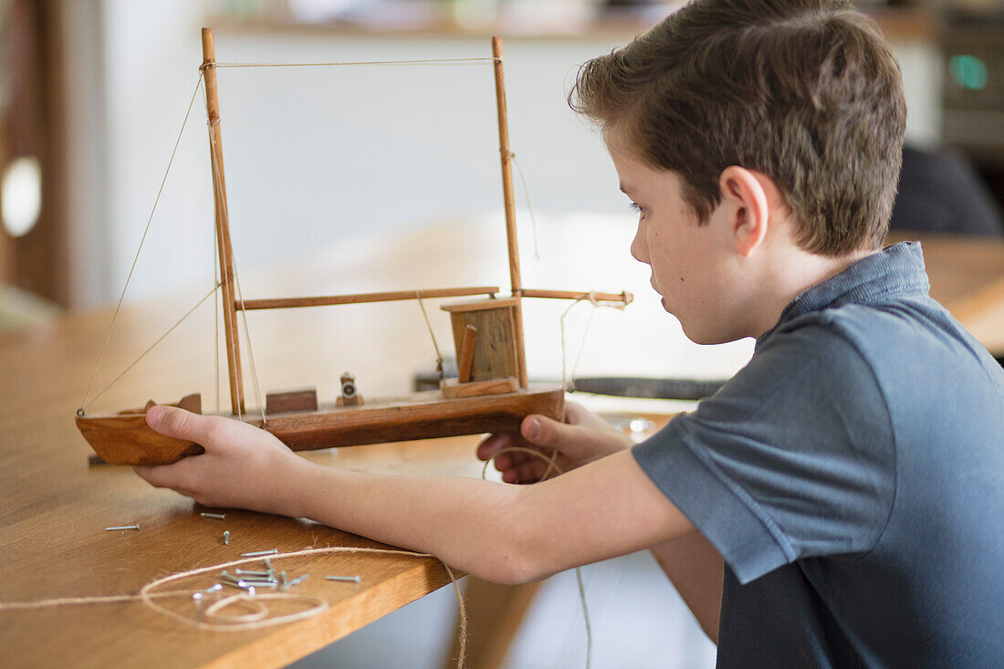 Boy Working on Model Ship