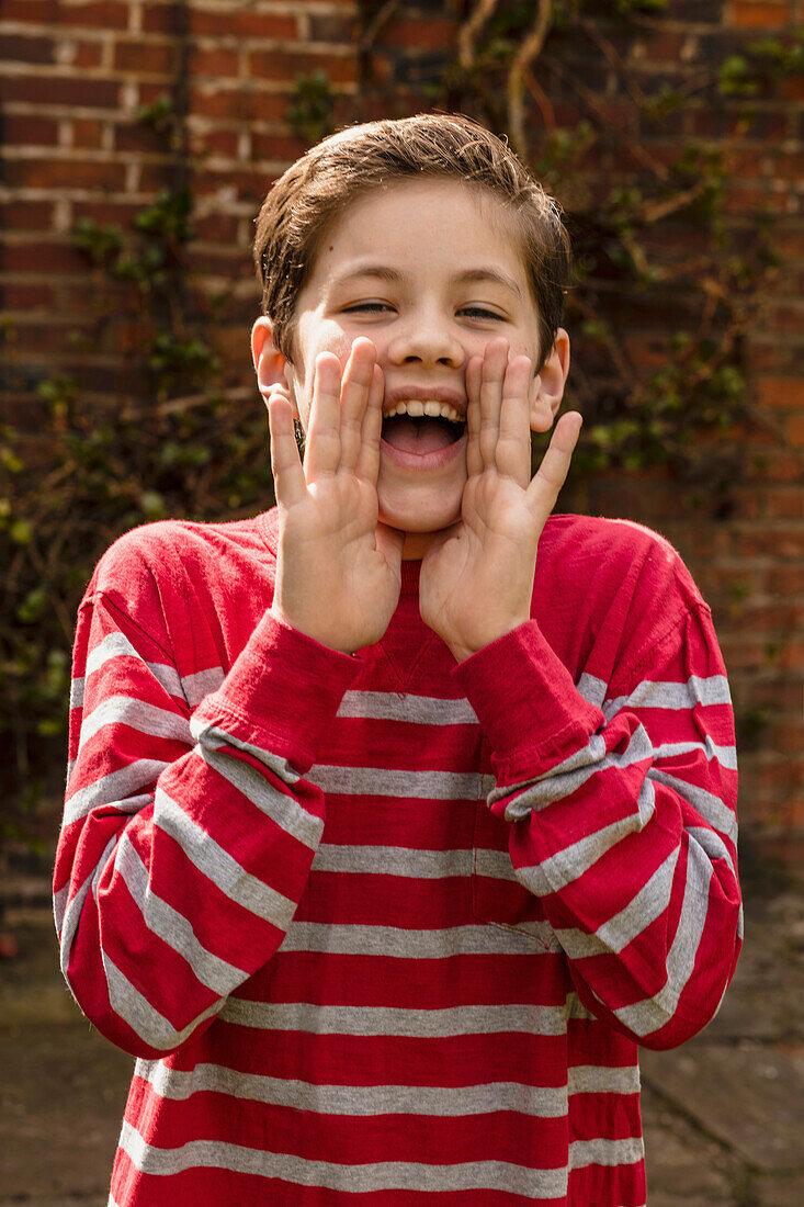 Portrait of Young Boy Shouting Outdoors