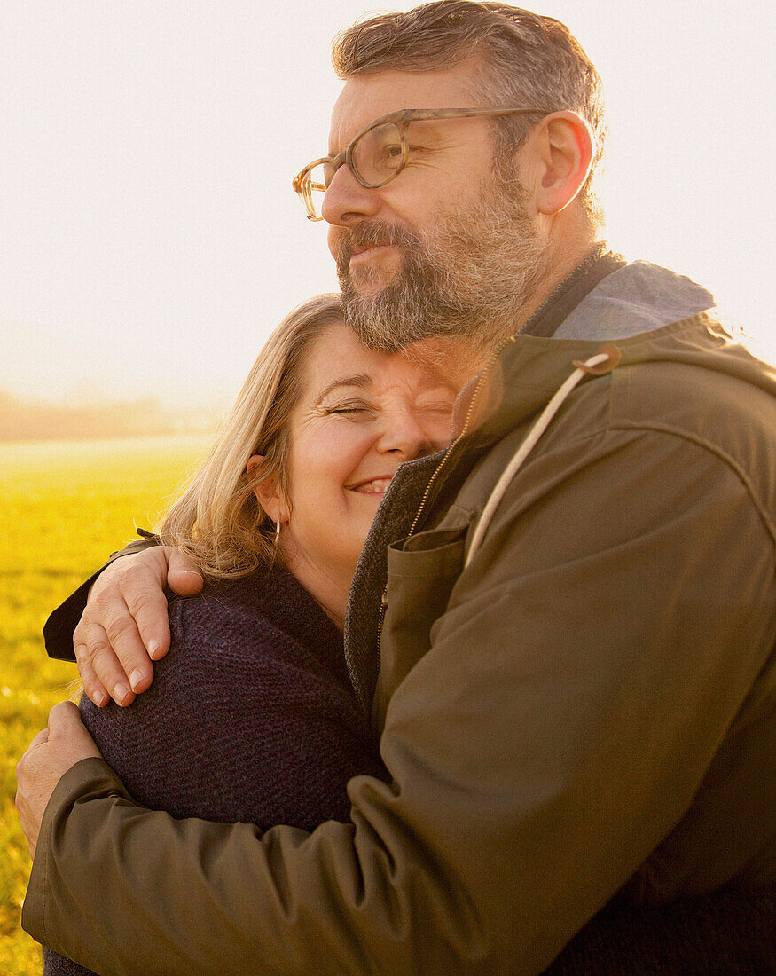 Couple Hugging in a Field