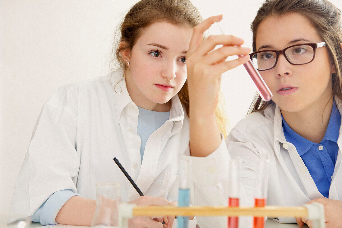 Schoolgirls at Chemistry Class Holding Test Tube