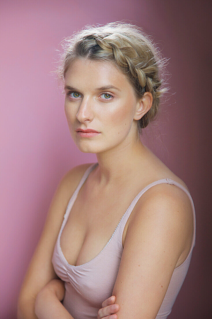 Young Woman with Arms Crossed Wearing Camisole