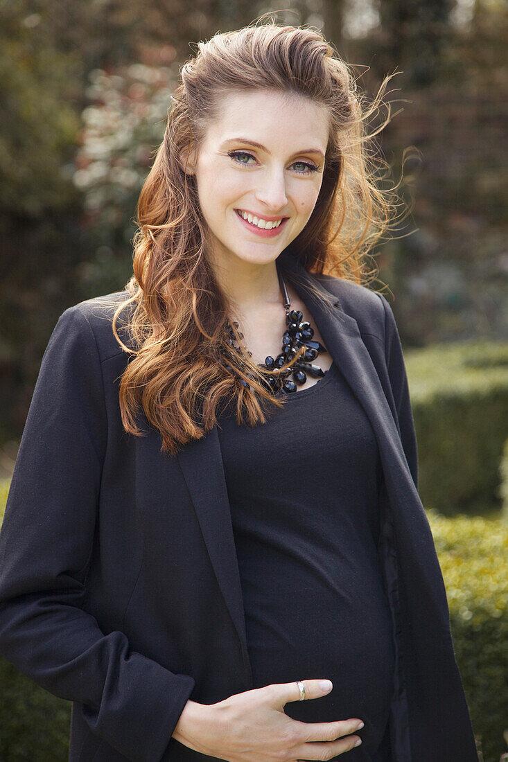 Smiling Pregnant Woman Outdoors