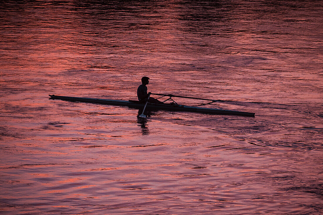 Kayakers at sunset on the Ebro River, Zaragoza, Spain