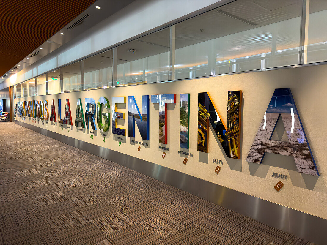 Colorful welcome sign at the Ministro Pistarini International Airport in Buenos Aires, Argentina.