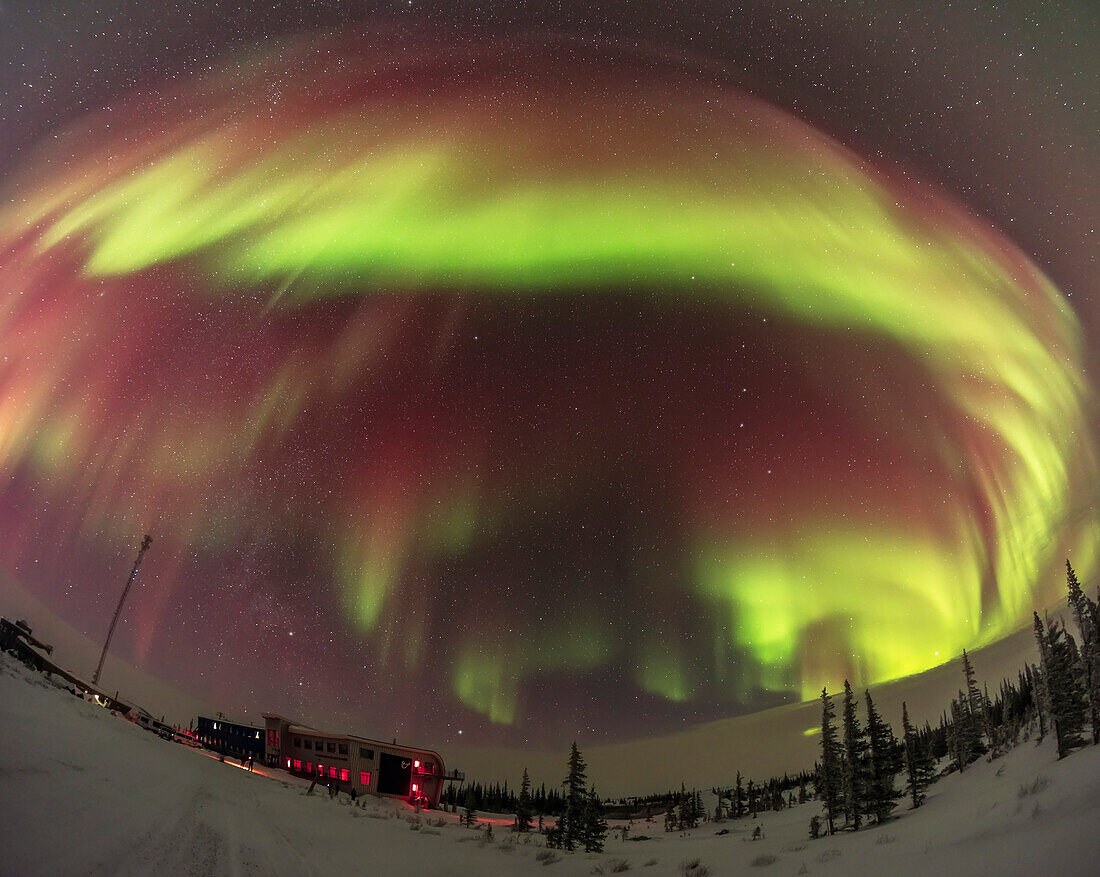 This is a two-segment vertical panorama of the sky-filling aurora of February 10, 2024, as seen and shot from the Churchill Northern Studies Centre, in Churchill, Manitoba, Canada. This was a Kp4-level display, though that was an unexpected level of activity this night. Predictions had been calling for only Kp1 or 2 at best.