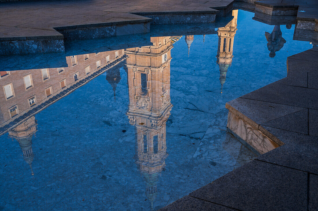 Cathedral-Basilica of Our Lady of the Pillar reflected on the fountain water in El Pilar Square, Zaragoza, Spain