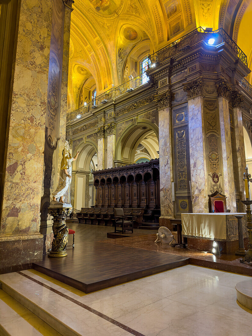 Carved wooden seats in the choir or quire in the apse of the Metropolitan Cathedral, Buenos Aires, Argentina.