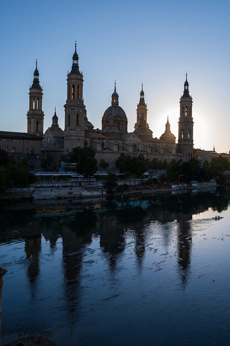 Cathedral-Basilica of Our Lady of the Pillar and the Ebro River bank at sunset, Zaragoza, Spain