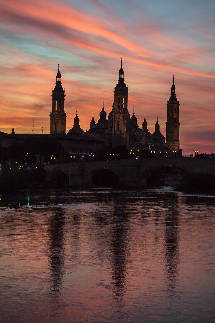 Cathedral-Basilica of Our Lady of the Pillar and the Ebro River bank at sunset, Zaragoza, Spain