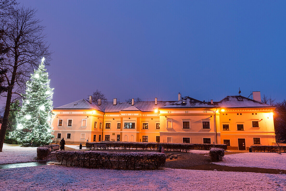 Snow-covered Cakovice Chateau and Christmas Tree, Cakovice, Praha 9, Czechia, Europe