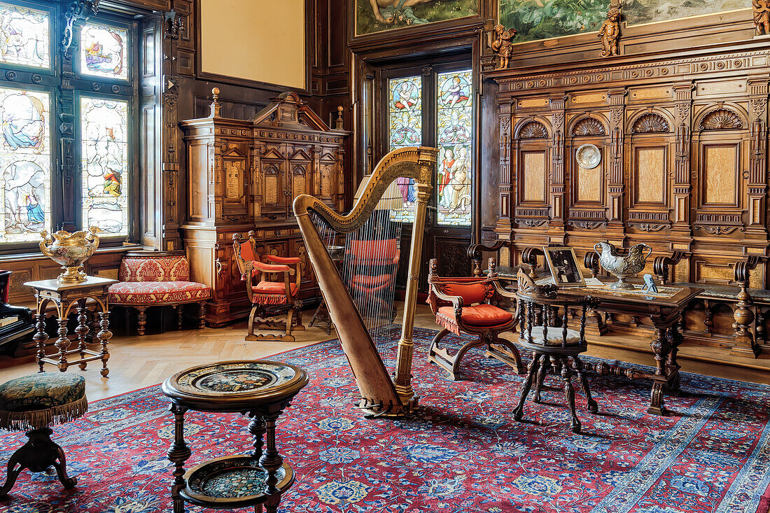 Interior decoration with a harp in the middle of the music room, Peles Castle, Sinaia, Romania, Europe