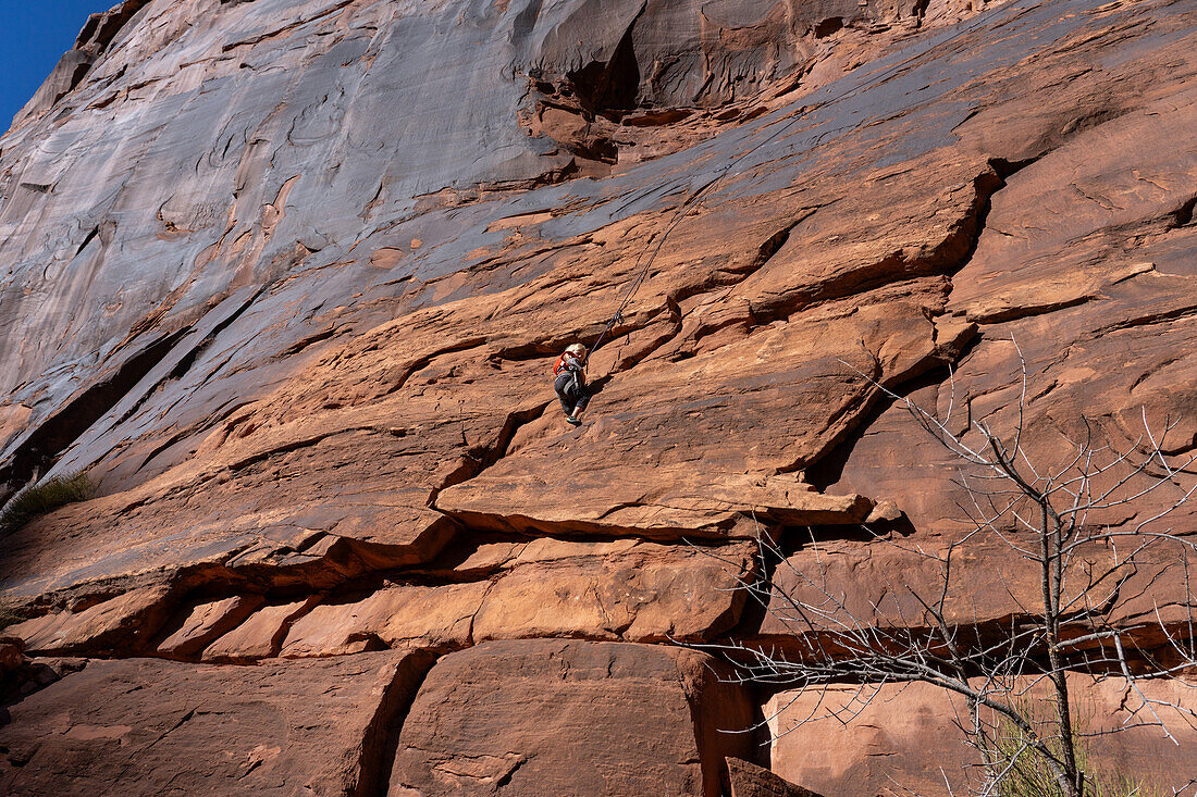 A young boy, age 3, learning to rock climb in Hunter Canyon near Moab, Utah.