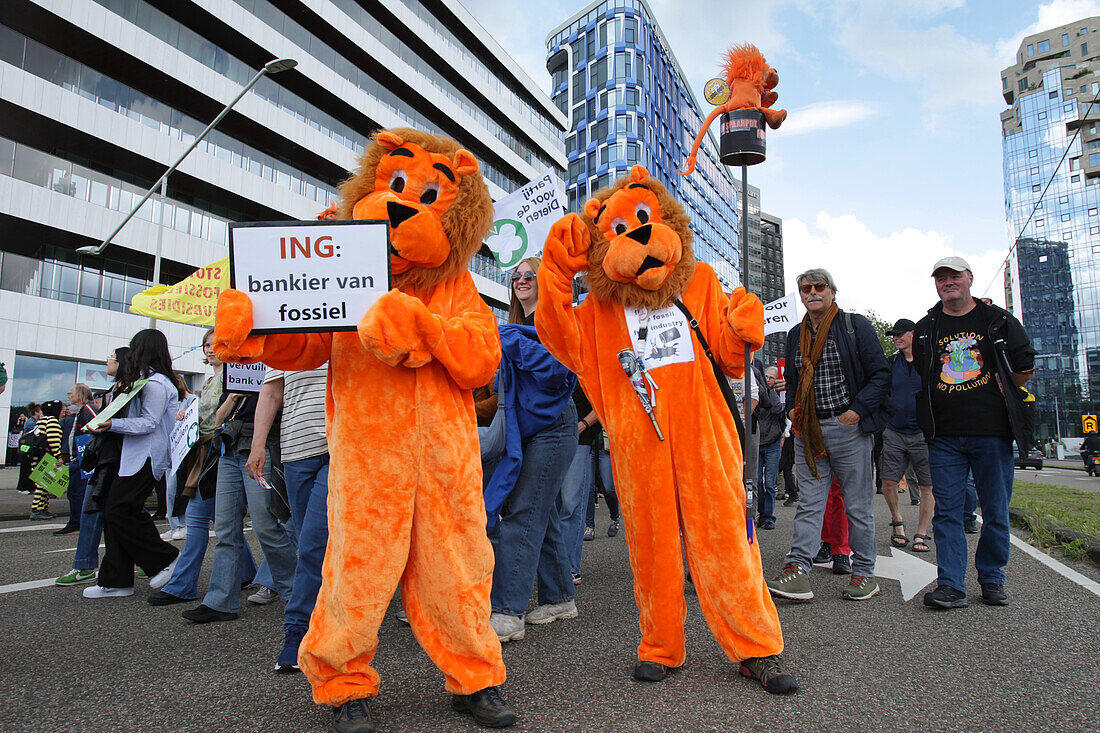 Environmental activists gather during march protest at the Zuidas financial district on May 31, 2024 in Amsterdam,Netherlands. Thousands of the environmental activists and supporters make a demonstration against the lobby of the large companies, their influence on politics, climate and ecological crisis and this consequences and demand a citizen's assembly for a just climate policy.